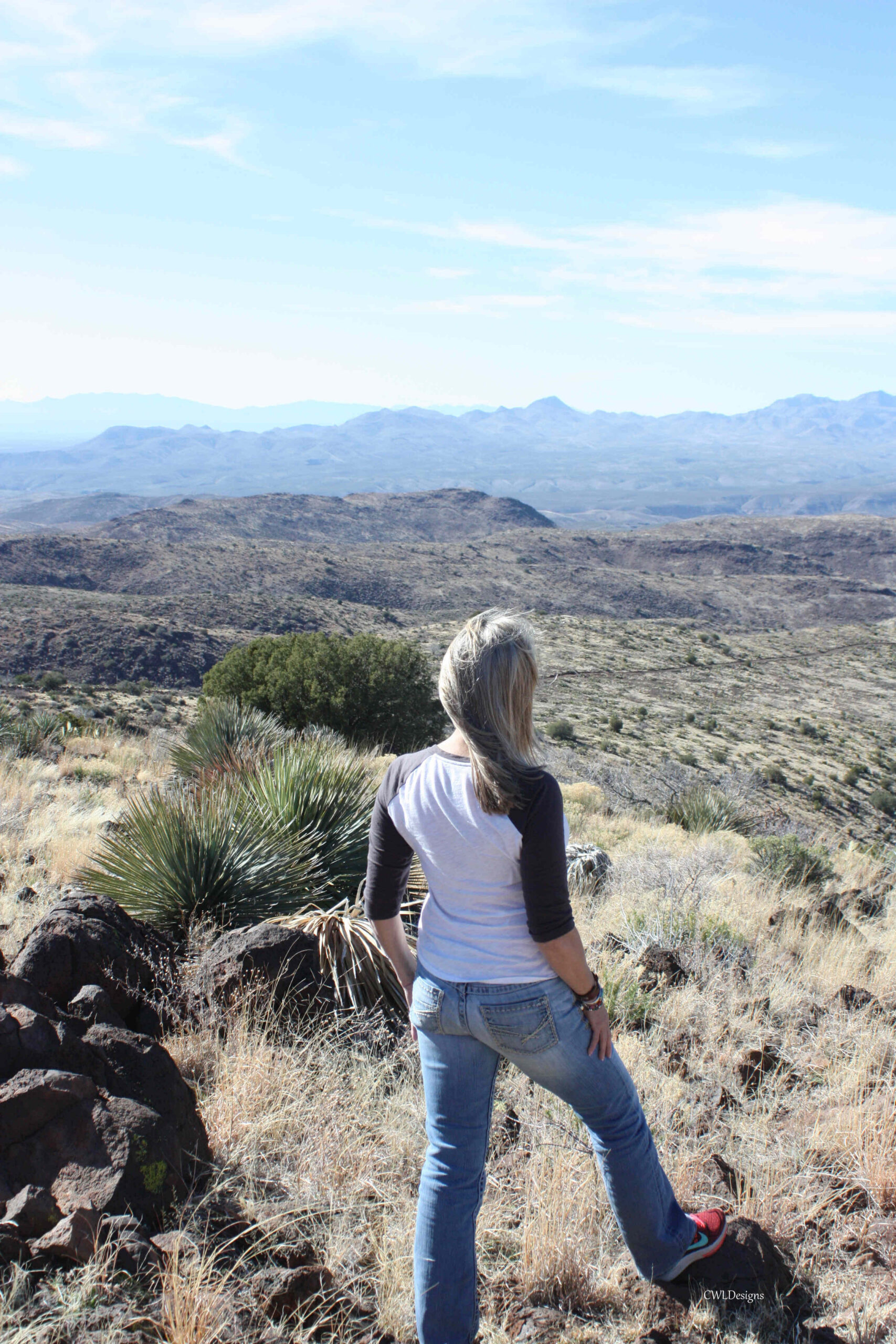 Mountain top photo of woman hiking
