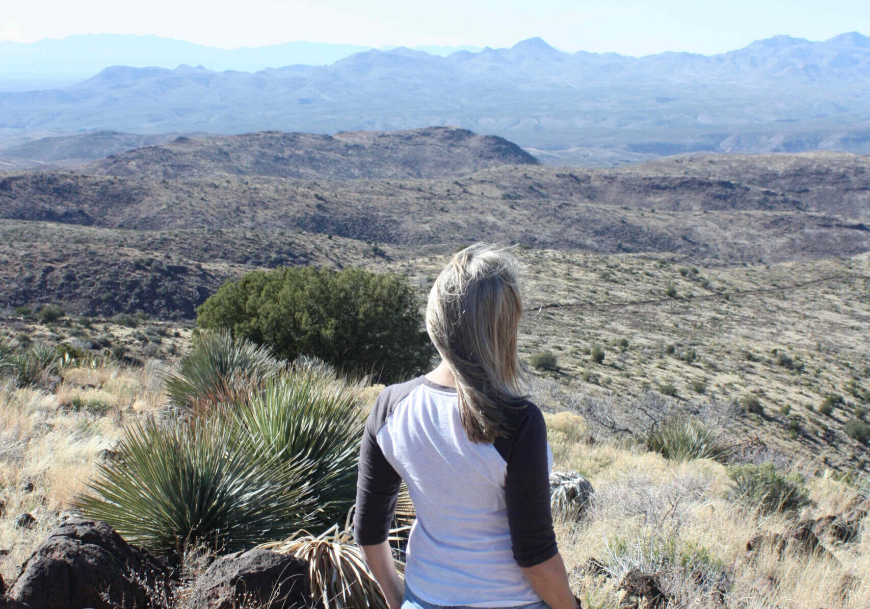 Mountain top photo of woman hiking