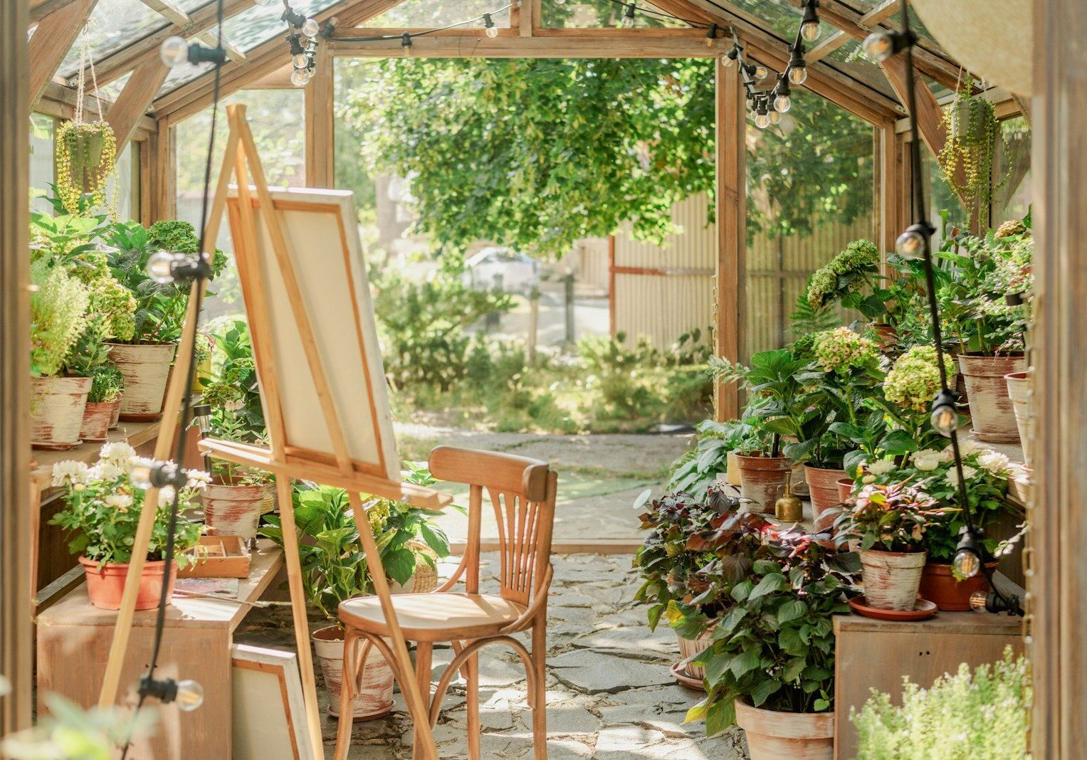 A garden filled with lots of potted plants